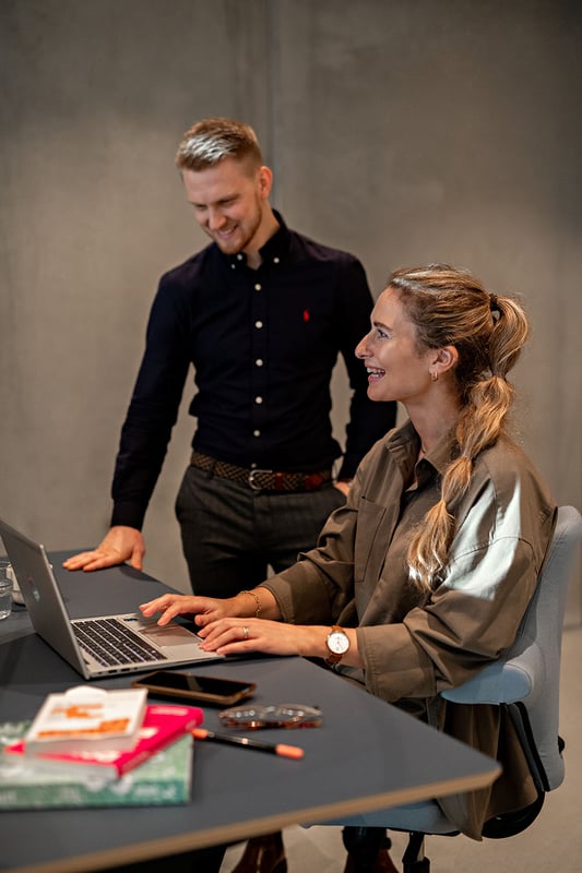 Two people working in an office 