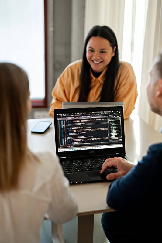 3 people and a PC with coding