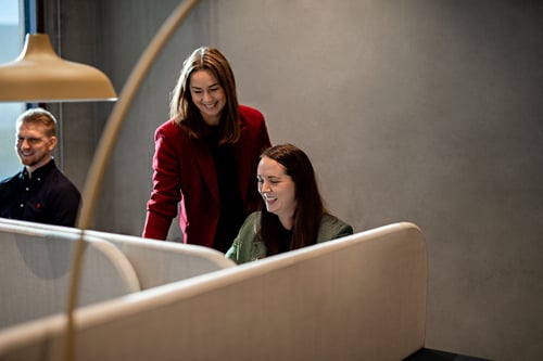 laughing at working together -1500x
